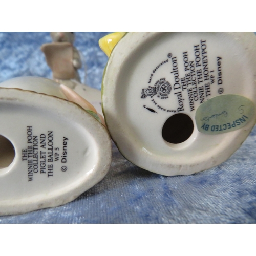 87 - 4 Royal Doulton Winnie the Pooh figurines.