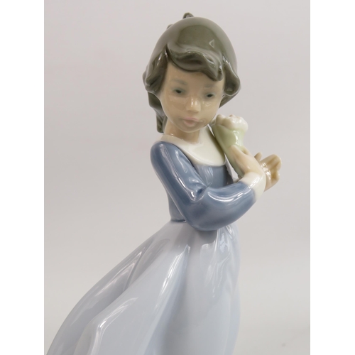 247 - 2 Nao figurines of girls one with a dog and one with flowers.