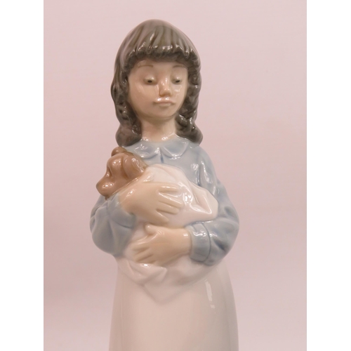 247 - 2 Nao figurines of girls one with a dog and one with flowers.