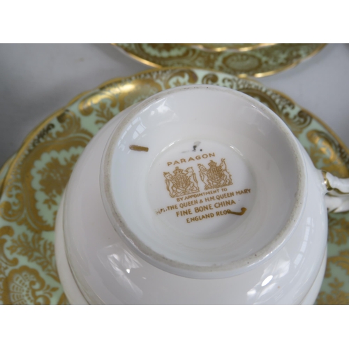 253 - 6 Paragon china trios, green and gilt with floral decoration.