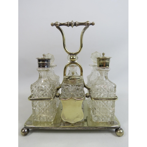 272 - 6 piece glass cruet condiment set in silver plated stand.