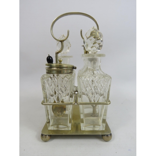 273 - 4 piece glass cruet condiment set in silver plated stand.