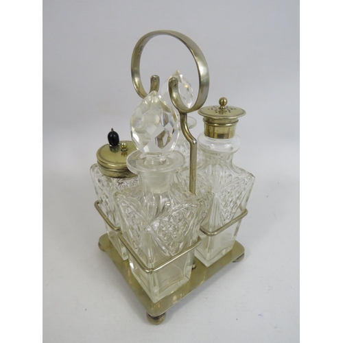 273 - 4 piece glass cruet condiment set in silver plated stand.