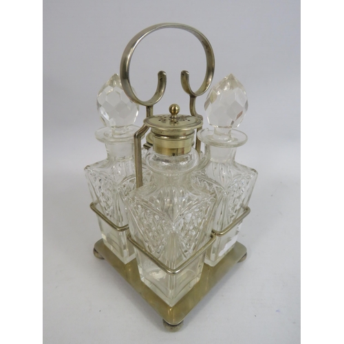 273 - 4 piece glass cruet condiment set in silver plated stand.