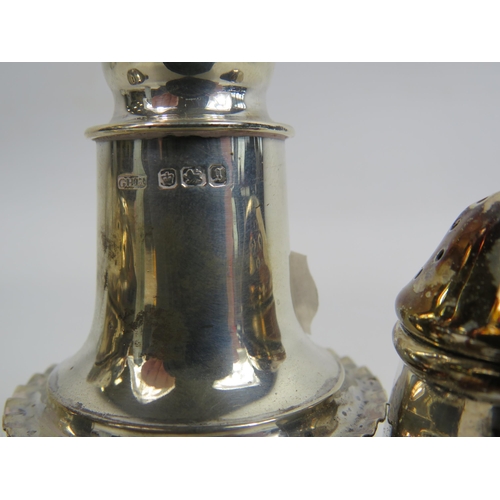 295 - Birmingham sterling silver Salt and pepper pot and a Sheffield pepper pot, total weight 69.6 grams.