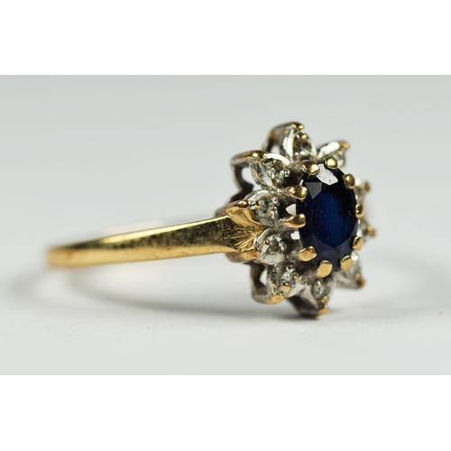 242 - 9ct white and yellow gold diamond and sapphire oval halo cluster dress ring (1.6g)     2041305