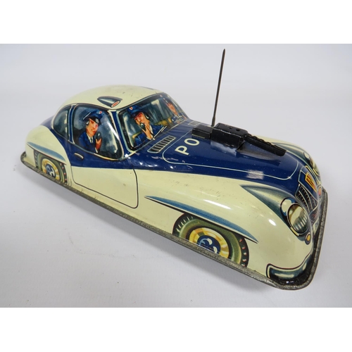 969 - Three British made Tin plate friction motor toy cars and loco.  Fair condition.  See photos.