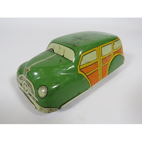 969 - Three British made Tin plate friction motor toy cars and loco.  Fair condition.  See photos.