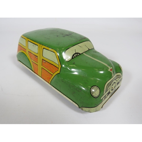 969 - Three British made Tin plate friction motor toy cars and loco.  Fair condition.  See photos.