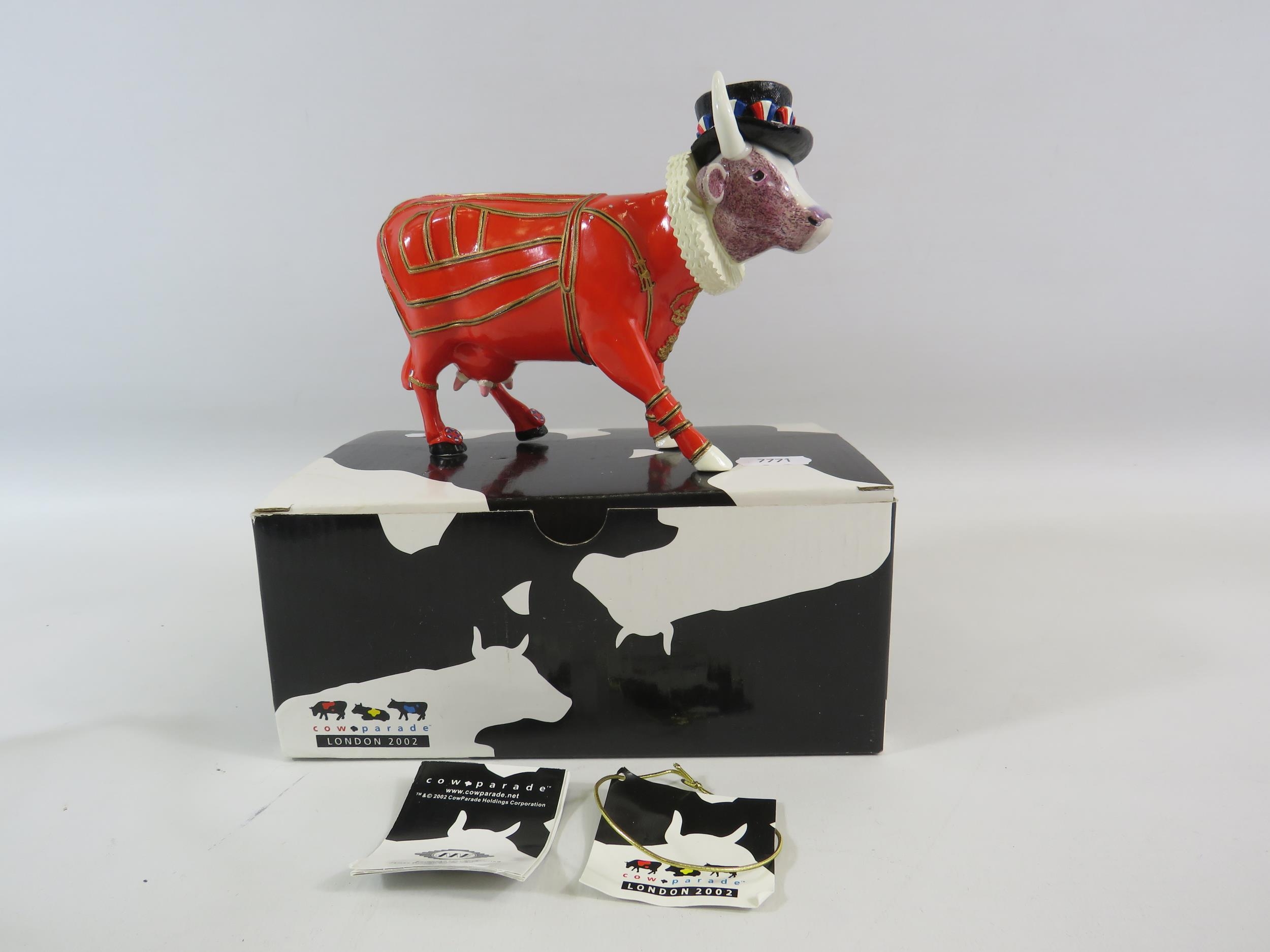 Cow Parade Beefeater cow figurine with box.