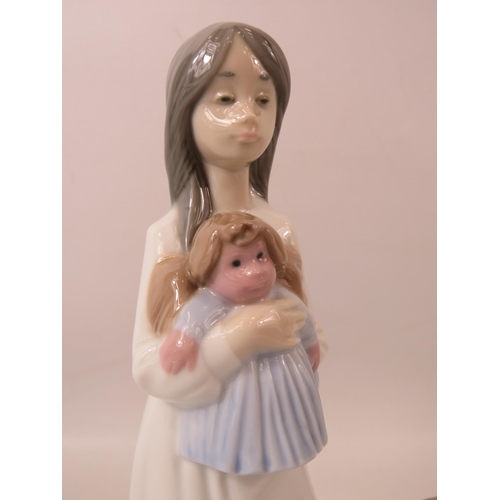 1 - 2 Nao Lladro figurines, a girl with a doll and a girl with a basket of flowers and a bird the talles... 