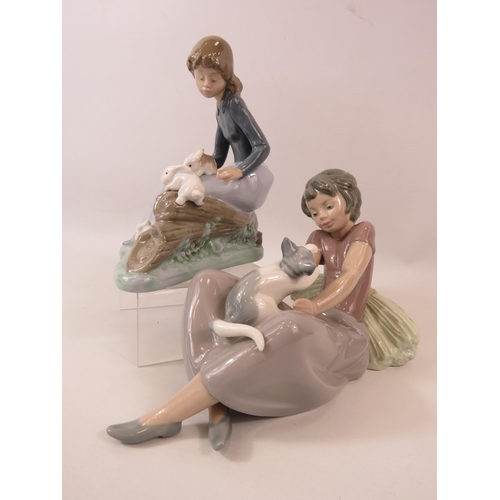 18 - 2 Nao Lladro figurines, a girl with 3 rabbits and a girl with a kitten.  The tallest measure 6 3/4