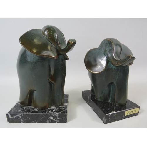 21 - Two S.A PAOR abstract bronze elephant sculptures standing on marble bases. The tallest measures 7