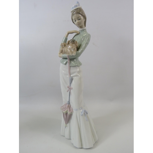 31 - Large Lladro figurine of a lady with a dog, approx 14.5