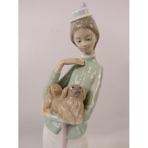 31 - Large Lladro figurine of a lady with a dog, approx 14.5