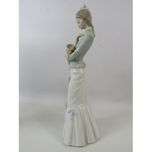 31 - Large Lladro figurine of a lady with a dog, approx 14.5