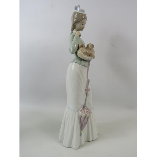 31 - Large Lladro figurine of a lady with a dog, approx 14.5