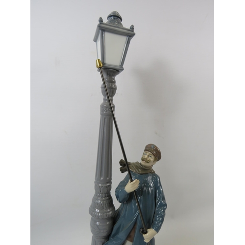 33 - Lladro figurine The Lamp lighter. Approx 18.5