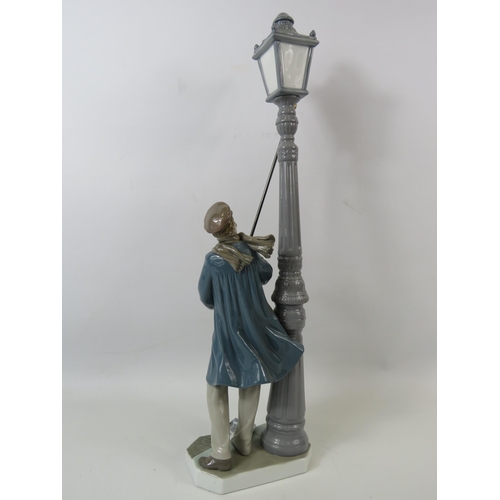 33 - Lladro figurine The Lamp lighter. Approx 18.5