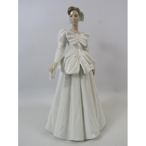 44 - Lladro figurine of a lady in a white wedding dress with bows, approx 11