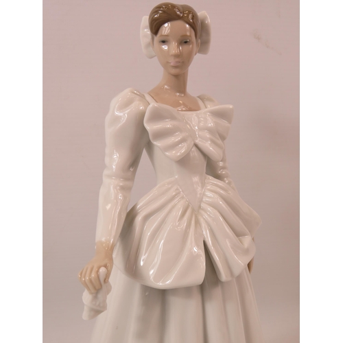 44 - Lladro figurine of a lady in a white wedding dress with bows, approx 11