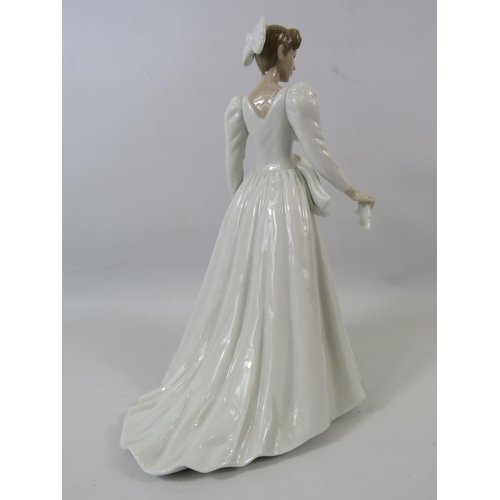 44 - Lladro figurine of a lady in a white wedding dress with bows, approx 11