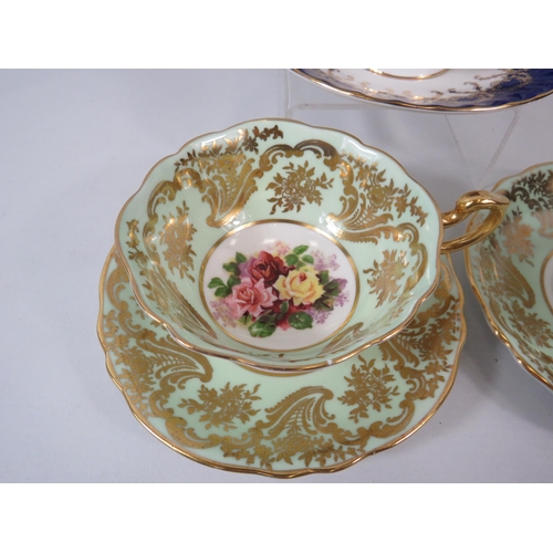 61 - 2 Paragon cabinet cups and saucer with Rose pattern centres plus one by Aynsley.