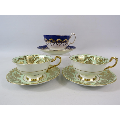 61 - 2 Paragon cabinet cups and saucer with Rose pattern centres plus one by Aynsley.