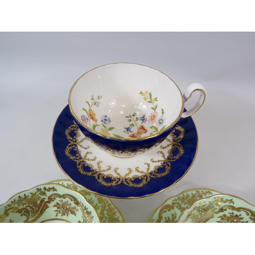 61 - 2 Paragon cabinet cups and saucer with Rose pattern centres plus one by Aynsley.