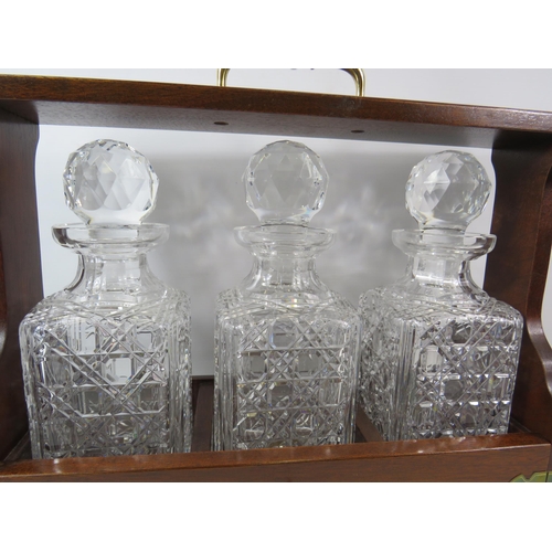 71 - Vintage Oak and brass Tantalus and 3 matching crystal glass decanters, 13.5