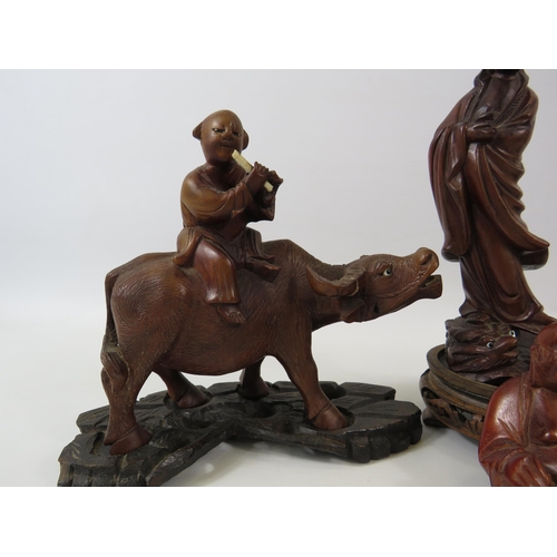 137 - Selection of oriental carved wood figures.