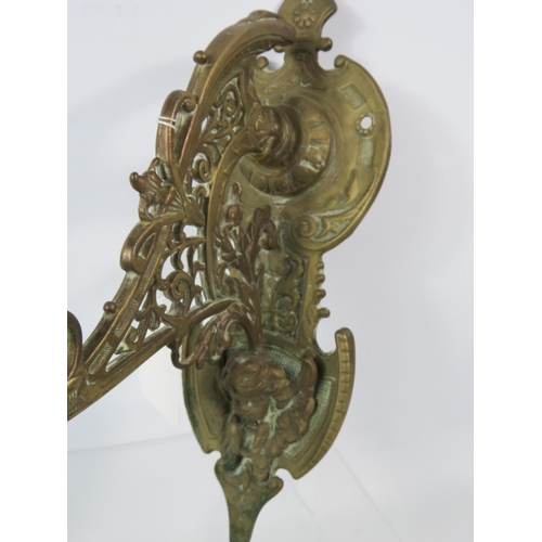 180 - Large out door brass bell with cherub detail.