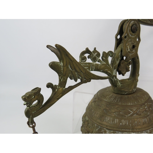 180 - Large out door brass bell with cherub detail.