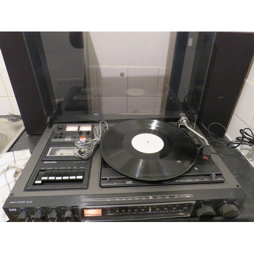 1751 - ITT Radio/casette/turntable with speakers.  Lights come on when plugged in but working condition unk... 