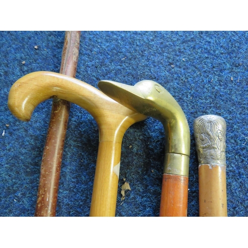 1965 - Four assorted walking sticks. See photos.  S2