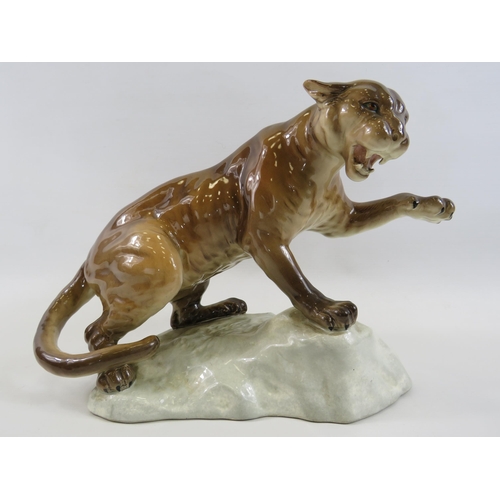 132 - Large Beswick Puma standing on a rock, model No 1702. Approx 8.5