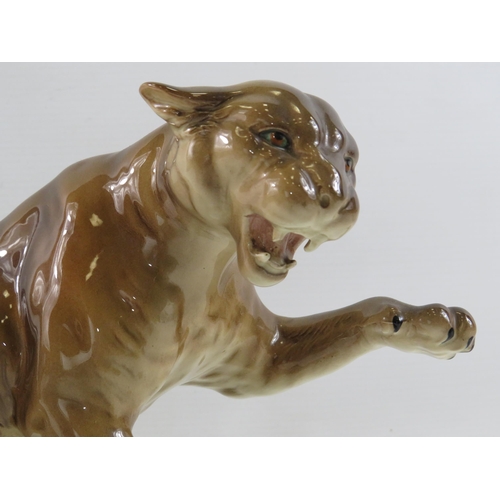 132 - Large Beswick Puma standing on a rock, model No 1702. Approx 8.5