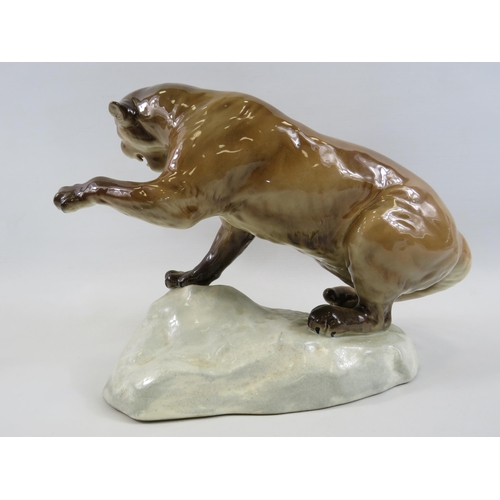 132 - Large Beswick Puma standing on a rock, model No 1702. Approx 8.5