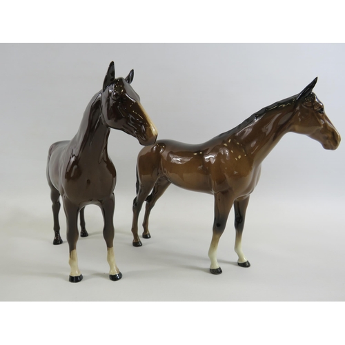 134 - 2 Beswick Bay race horse figurines in different colourways.