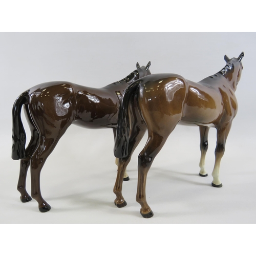 134 - 2 Beswick Bay race horse figurines in different colourways.