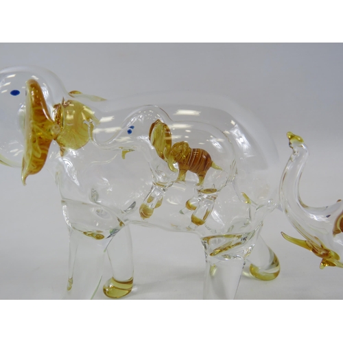 137 - Two hand blown glass Elephants with smaller elephants within, the tallest measures 6