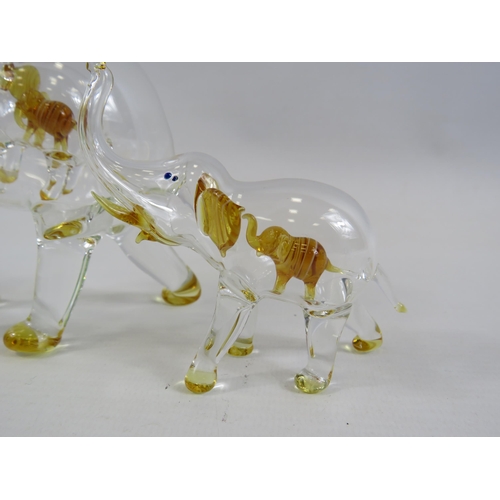 137 - Two hand blown glass Elephants with smaller elephants within, the tallest measures 6