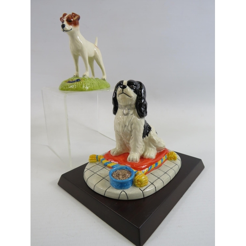 194 - 2 Royal Doulton dog Figurines of a King Charles Cavarlier and a Jack Russel. Both come with boxes.