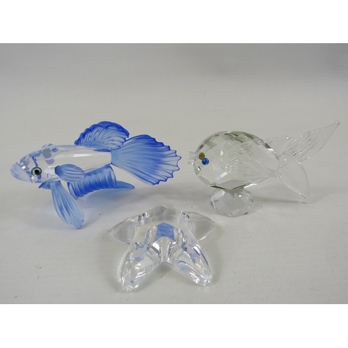 199 - Swarovski Siamese fighting fish, Star fish plus one other swarovski fish figurine.