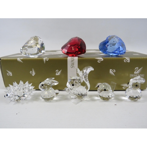 215 - 3 Swarovski crystal hearts and 5 small swarovski animal figures.