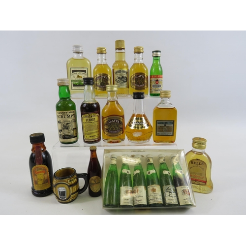 224 - Selection of vintage miniature whiskeys and wines.