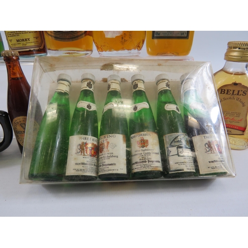 224 - Selection of vintage miniature whiskeys and wines.