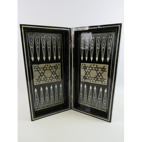 230 - Egyptian folding Chess/backgammon board lacquered with mother of pearl inlay.