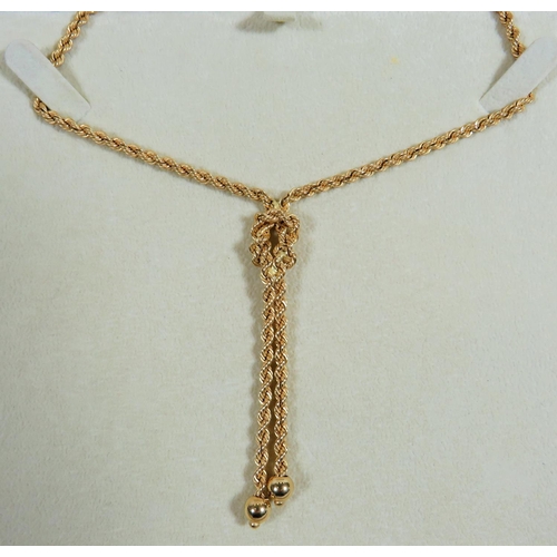 303 - 18ct Twist rope neck chain with knot style pendant woven in.  Overall length  22 inches. Total weigh... 