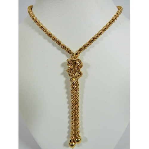 303 - 18ct Twist rope neck chain with knot style pendant woven in.  Overall length  22 inches. Total weigh... 